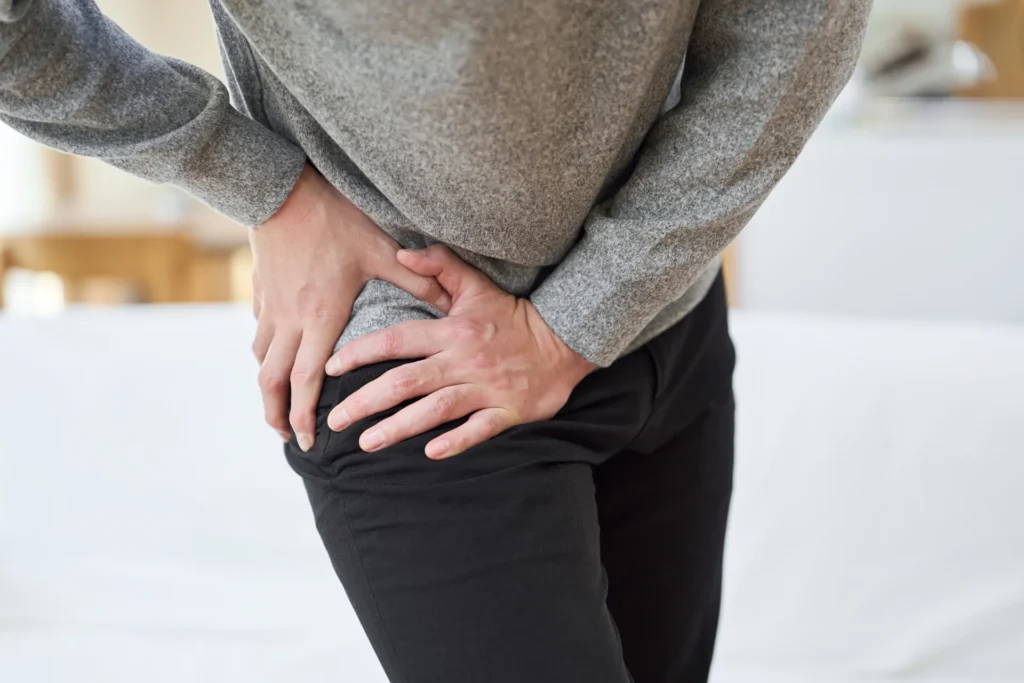 adult experiencing hip pain at home 2026 03 05 11 53 47 utc