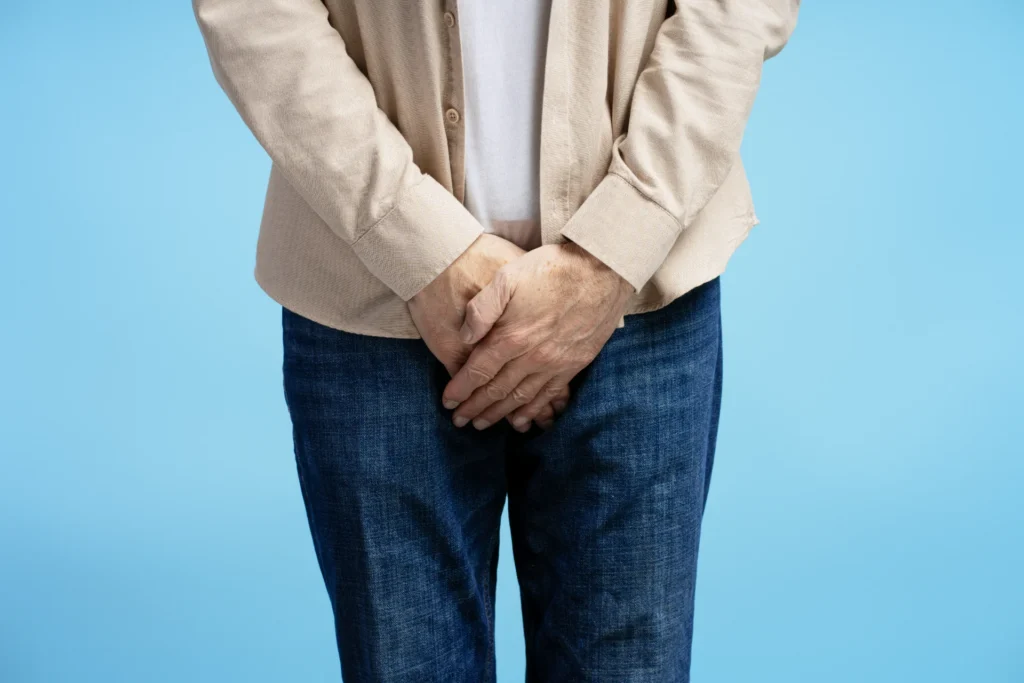 senior man experiencing discomfort holding groin a 2026 03 20 03 55 14 utc