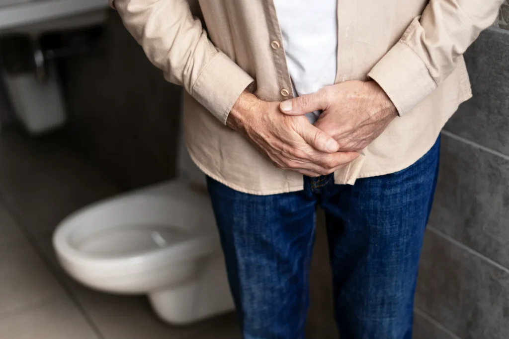 unwell adult torso leaning in a bathroom 2026 01 08 08 10 07 utc